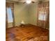Bedroom with hardwood flooring, green walls, ornate curtains, and ceiling fan at 1014 Skyway Dr, Kannapolis, NC 28083