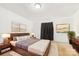 Serene primary bedroom featuring a stylish bed, elegant decor, and soft, neutral tones at 103 Palace Pt, Kings Mountain, NC 28086