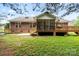 Large backyard view showing screened porch and deck at 112 Chasse Ct, Cleveland, NC 27013
