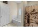 Bathroom with tiled floor, shower curtain and bathtub at 112 Chasse Ct, Cleveland, NC 27013