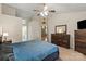 Bedroom with patterned bedding, dark wooden furniture, and light colored walls at 112 Chasse Ct, Cleveland, NC 27013