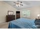 Bedroom with a ceiling fan, light colored walls and a large window to provide natural light at 112 Chasse Ct, Cleveland, NC 27013