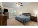Bedroom with large window, ceiling fan, carpeting and bed with blue comforter at 112 Chasse Ct, Cleveland, NC 27013