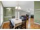 Charming dining area with elegant lighting and seamless flow to living spaces at 112 Chasse Ct, Cleveland, NC 27013