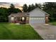 Charming brick home with a two-car garage and manicured lawn at sunset at 112 Chasse Ct, Cleveland, NC 27013