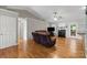 Spacious living room featuring hardwood floors, a fireplace, and ample seating at 112 Chasse Ct, Cleveland, NC 27013
