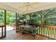 Cozy screened porch with ceiling fan and backyard view at 112 Chasse Ct, Cleveland, NC 27013