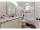 Full bathroom with granite countertop, white cabinets, brushed hardware and modern fixtures at 1134 Fincher Rd, Fort Lawn, SC 29714