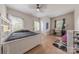 Comfortable bedroom with light walls, ceiling fan, light hardwood floors and ample natural light at 1134 Fincher Rd, Fort Lawn, SC 29714