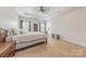 Bright bedroom with tray ceilings, hardwood floors, two windows, and lots of space at 1134 Fincher Rd, Fort Lawn, SC 29714