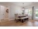 Bright dining room featuring a stylish table set, chandelier lighting and lots of natural light at 1134 Fincher Rd, Fort Lawn, SC 29714