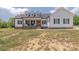 Charming two-story farmhouse style home featuring a welcoming front porch and dormer windows at 1134 Fincher Rd, Fort Lawn, SC 29714