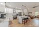 Kitchen featuring a central island with seating, stainless appliances, and white cabinetry at 1134 Fincher Rd, Fort Lawn, SC 29714