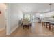 Bright eat-in kitchen with stainless appliances, white cabinets, island bar seating and hardwood floors at 1134 Fincher Rd, Fort Lawn, SC 29714
