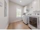 Well-lit laundry room with modern appliances, built-in cabinetry, and a window at 1134 Fincher Rd, Fort Lawn, SC 29714