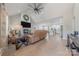Open concept living room with fireplace, television, ceiling fan and a view to the kitchen at 1134 Fincher Rd, Fort Lawn, SC 29714