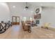Bright living room with a fireplace, large television, hardwood floors, and comfortable furniture at 1134 Fincher Rd, Fort Lawn, SC 29714