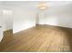 Bright bedroom with hardwood floors, natural light, and neutral paint at 1212 Beechdale Dr, Charlotte, NC 28212