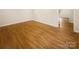Empty room with hardwood floors and neutral walls offering a blank canvas for any decor style at 1212 Beechdale Dr, Charlotte, NC 28212