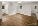 Bright bedroom with hardwood floors, natural light, and neutral paint at 1212 Beechdale Dr, Charlotte, NC 28212