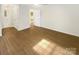 Bedroom with hardwood floors, neutral walls, and a ceiling fan at 1212 Beechdale Dr, Charlotte, NC 28212
