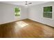 Bright bedroom with hardwood floors and two windows offering natural light at 1212 Beechdale Dr, Charlotte, NC 28212