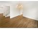 Bright dining room with hardwood floors and modern chandelier at 1212 Beechdale Dr, Charlotte, NC 28212