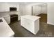Spacious kitchen island with modern appliances and eat-in dining space at 1212 Beechdale Dr, Charlotte, NC 28212