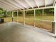 Enclosed patio with ceiling, tile flooring and view of the spacious backyard at 1212 Beechdale Dr, Charlotte, NC 28212