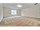 Large, open bonus room providing ample space for recreation and activities at 125 S Prestwick Way # 41, Mooresville, NC 28115