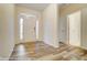 Inviting entryway with natural light, laminate floors, and white trim, a welcoming first impression at 125 S Prestwick Way # 41, Mooresville, NC 28115