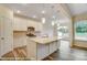 Bright and modern kitchen featuring stainless steel appliances, an island, and sleek finishes at 125 S Prestwick Way # 41, Mooresville, NC 28115