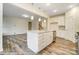 Open kitchen with stainless steel dishwasher, island, and pendant lights, seamless entertaining space at 125 S Prestwick Way # 41, Mooresville, NC 28115
