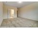 Spacious main bedroom with carpet, two closets, neutral walls, and access to the main bathroom at 125 S Prestwick Way # 41, Mooresville, NC 28115