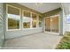 Covered patio space with sliding glass door entry into the home's interior at 125 S Prestwick Way # 41, Mooresville, NC 28115