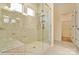 Walk-in shower with glass door and tile surround in the main bathroom at 125 S Prestwick Way # 41, Mooresville, NC 28115