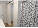 Bathroom featuring a sliding barn door closet and a shower with a decorative curtain at 1277 Eden Dr # 18, Chester, SC 29706