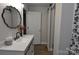 Stylish bathroom features a sliding barn door closet, decorative mirror, and a white vanity with black hardware at 1277 Eden Dr # 18, Chester, SC 29706