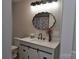 Beautiful bathroom featuring a decorative mirror, white vanity, and a sleek black faucet at 1277 Eden Dr # 18, Chester, SC 29706