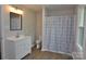 Bright bathroom featuring a stylish vanity, toilet, and shower with a patterned curtain at 1277 Eden Dr # 18, Chester, SC 29706