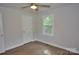 Light-filled bedroom with a ceiling fan, window, and wood-look flooring at 1277 Eden Dr # 18, Chester, SC 29706