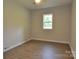 Bedroom featuring a window and wood-look flooring at 1277 Eden Dr # 18, Chester, SC 29706