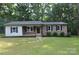 Charming single-story home with a brick facade, manicured lawn, and mature trees at 1277 Eden Dr # 18, Chester, SC 29706