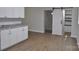 This is a kitchen with a countertop, wooden floors and new, stylish, white cabinets at 1277 Eden Dr # 18, Chester, SC 29706