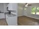 This kitchen features wooden floors, a ceiling fan and stainless steel appliances at 1277 Eden Dr # 18, Chester, SC 29706