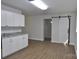 This is a kitchen with a countertop, wooden floors and new, stylish, white cabinets at 1277 Eden Dr # 18, Chester, SC 29706