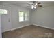 Bright living room featuring hardwood floors, a ceiling fan, and a large window at 1277 Eden Dr # 18, Chester, SC 29706