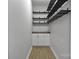 This storage space has wooden floors, white cabinets, countertop and mounted wooden shelves at 1277 Eden Dr # 18, Chester, SC 29706