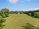Aerial view of the expansive property featuring lush green lawns and mature trees at 130 Johnson Dairy Rd, Rockwell, NC 28138
