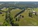 Gorgeous aerial view of the property, showcasing lush greenery and a tranquil setting at 130 Johnson Dairy Rd, Rockwell, NC 28138